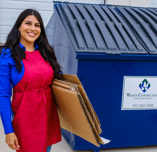 Small business owner using Waste Connections 1 yd dumpster for cardboard waste
